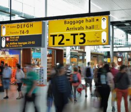 People Walking Beside Baggage Hall and Arrivals Hall Signage - Antalya airport transfers